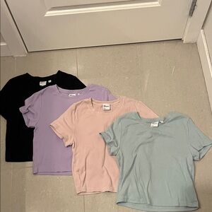 4 TNA homestretch tees in pink, teal, black and lavender